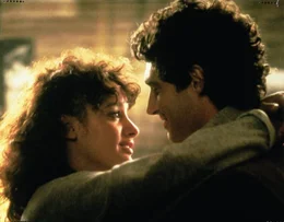 L-R: Alex Owens (Jennifer Beals) und Nick Hurley (Michael Nouri)