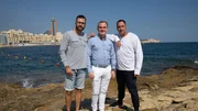 Adam Thomison (R) with his friend Milos Sarac (L) and Colin Porter Johnson (C), the realtor, standing at the waterfront in the area of Sliema, Malta, as seen on Mediterranean Life Adam Thomison (R) with his friend Milos Sarac (L) and Colin Porter Johnson (C), the realtor, standing at the waterfront in the area of Sliema, Malta, as seen on Mediterranean Life