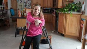 Nicole DePaul sits in a chair with her crutches during an interview Nicole DePaul sits in a chair with her crutches during an interview