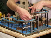 Model maker Felix is installing a ship with pirate skeletons on the Grund. Model maker Felix is installing a ship with pirate skeletons on the Grund.