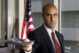 Frank Dixon (Stanley Tucci)