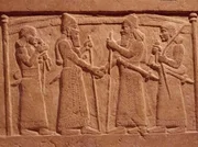 Oriental art. Detail of pedestal of Salmanasar III's throne (858–823 BC) of Nimroud (formerly Calach). On the left, the king Salmanasar III, on the right, the king of Babylonia the god Mardouk. Museum of Baghdad. Oriental art. Detail of pedestal of Salmanasar III's throne (858–823 BC) of Nimroud (formerly Calach). On the left, the king Salmanasar III, on the right, the king of Babylonia the god Mardouk. Museum of Baghdad.