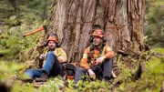 Hand Fallers Chris Hersics and Brendan Bowman take a rest beneath their latest money tree in the Pacific Northwest. Hand Fallers Chris Hersics and Brendan Bowman take a rest beneath their latest money tree in the Pacific Northwest.