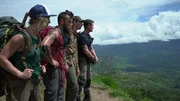 Wide hero shot of (L-R) Sam, Parker, Fred, Karla overlooking the landscape of PNG – side facing Wide hero shot of (L-R) Sam, Parker, Fred, Karla overlooking the landscape of PNG – side facing