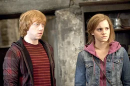 Rupert Grint (Ron Weasley), Emma Watson (Hermine Granger).