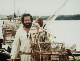 Die beiden unkonventionellen Missionare Pater J. (Terence Hill, hinten) und Pater Pedro (Bud Spencer, vorne) z&uuml;chten Papageien und verkaufen Kaffee und Pfeffer zum Wohle der Eingeborenen. Doch das passt dem raffgierigen Gouverneur nat&uuml;rlich nicht, und er will die beiden aus dem Weg haben ...