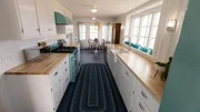 An after photo of the kitchen with the dining room nook in the background, as seen on Farmhouse Fixer, Season 3. An after photo of the kitchen with the dining room nook in the background, as seen on Farmhouse Fixer, Season 3.