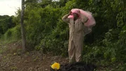 Jake putting on a pink tutu as a head wrap.