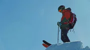 A woman ready to ski down.