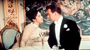 Dr. Gabriel Eisenstein (Peter Alexander) staunt nicht schlecht, als er auf dem Ball seine Frau Rosalinde (Marianne Koch) antrifft.