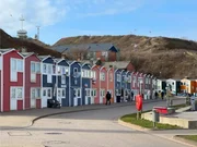 Hummerbuden (lobster huts) located along the harbor on the German North Sea island of Helgoland. Hummerbuden (lobster huts) located along the harbor on the German North Sea island of Helgoland.