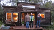 Homebuyers Amanda (left) and Lance (center) tour this 256 sqft customizable tiny house on wheels with real estate agent Stephanie Johnson (right) in Asheville, NC.