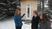 Real estate agent Amy (left) is excited to show homebuyers Alex (center) and Korie (right) this 144 sq. ft. tiny house on wheels in Elgin, IL. As seen on Tiny House Hunters.