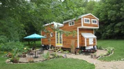 This tiny cabin in Ripon, WI is on the larger side at 402 sq. feet and features two lofts, a bath and an eclectic interior with lots of natural light.