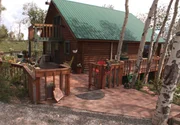 Exterior of Home 3, a log cabin that sits 8501 feet above sea level.