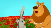 L-R: The Tin Man (voiced by J. P. Karliak), The Cowardly Lion (voiced by Jess Harnell)