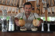 Giles Coren making drinks at the bar at The Brando Hotel, French Polynesia.