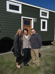 Realtor Kristi (L) is excited to show homebuyers, Kristi and Rapahel all what this 320 sq ft. cottage style tiny home has to offer. Located in Flat Rock, NC,