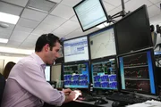 Picture Shows: Most financial trading is electronic. Day trader Scott Redler, the Chief Strategic Officer at T3 Trading Group, watches his screens