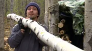 Matt hauls a log for the trapper shack.