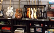 Guitars displayed on the wall.