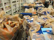 Shopping carts filled with bagged items.