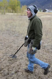 Butte, MT, USA: Tim Saylor at the location of the 5 Mile Bar & Grill with his metal detector.
