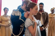 BRIDGERTON (L to R) FREDDIE STROMA as PRINCE FRIEDERICH, PHOEBE DYNEVOR as DAPHNE BRIDGERTON and REGÉ-JEAN PAGE as SIMON BASSET in episode 104 of BRIDGERTON Cr. LIAM DANIEL/NETFLIX © 2020
