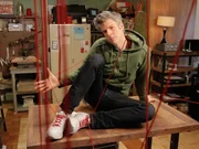 David Rees poses on top of his workbench with 50-foot laces strewn about his workshop. Rope actually predates shoelaces as a knot tying material by a wide margin. Evidence of string and rope making in Europe goes back 28,000 years.